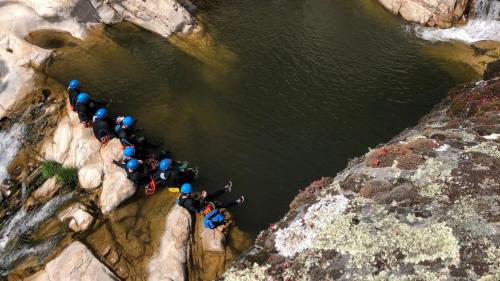 Hikers take a rest while canyoning in Bau Mela