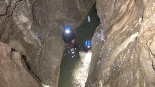 Two hikers while canyoning in Donini Cave in Urzulei