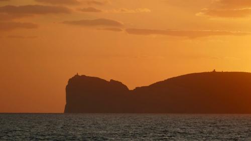 View of the stacks of Capo Caccia at sunset