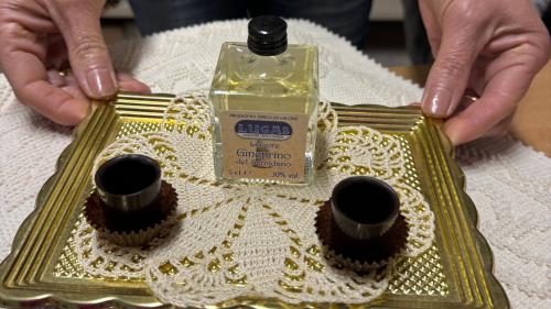 Tasting of typical Sardinian herb-flavoured liqueurs at a company in Laconi