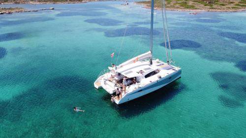 Top view of the catamaran in the crystal-clear waters of the Asinara National Park