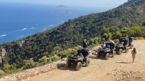 ATVs stop on a road in Ogliastra