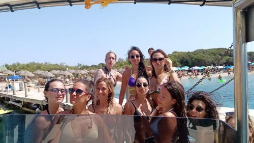 Group of young girls on board the dinghy in Costa Smeralda