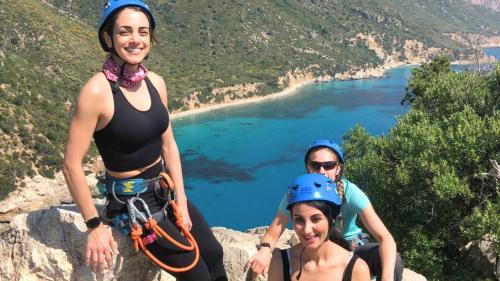 Group of hikers during a rope descent with guide and equipment