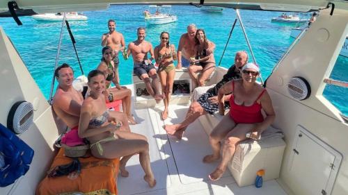 Group of people aboard the speedboat in the Maddalena coves