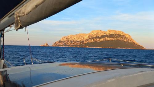 Sunset from the catamaran with Tavolara on the horizon