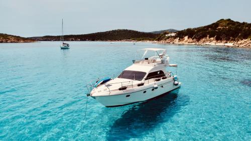 Yacht in the crystal-clear waters of the Villasimius coastline