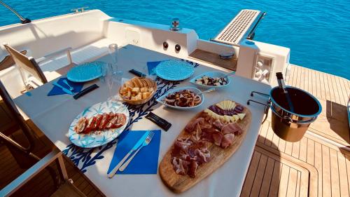 Table with various appetizers served during the daily tour in Villasimius