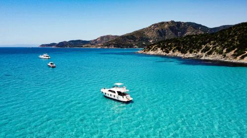 Yacht in the crystal-clear waters of Villasimius