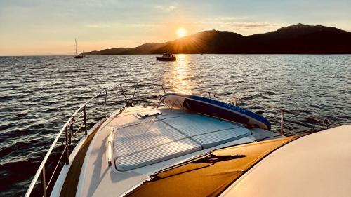 Prow of the yacht at sunset in the Villasimius coastline