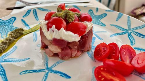 Tuna and cherry tomato tartare served on board of the yacht during the day trip in the south coast of Sardinia