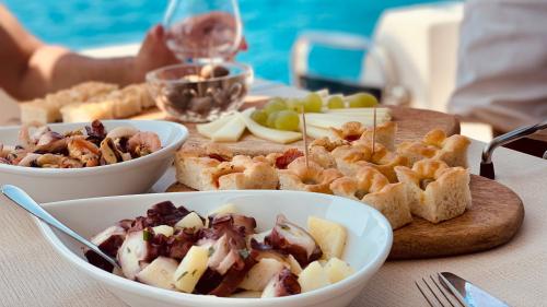 Appetizers served on board the yacht during an excursion in the waters of Villasimius