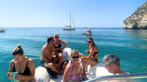 People on board the dinghy as they prepare to snorkel in the Gulf of Angels