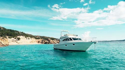 Yacht in the crystal-clear waters of the La Maddalena archipelago