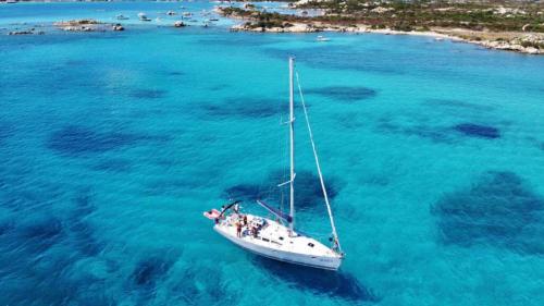 Sailing boat while sailing in the crystal-clear waters of the archipelago