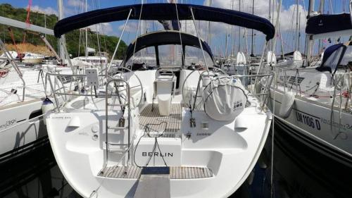 Stern of the sailboat while moored in the jetty in Cannigione