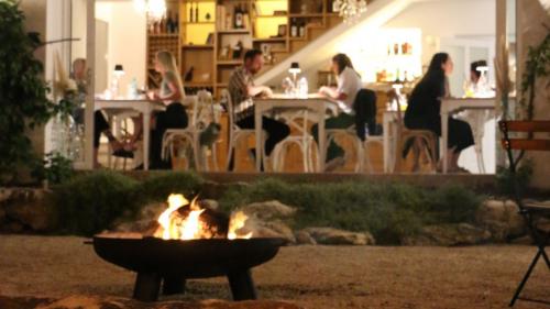 People relaxing during dinner at the villa