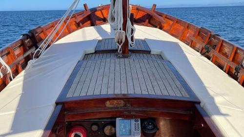 Lounge with cushions inside the boat at Asinara