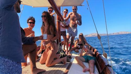 Group of young people having fun during the Asinara tour