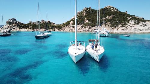 Sailing boats in the crystal-clear waters of the La Maddalena archipelago