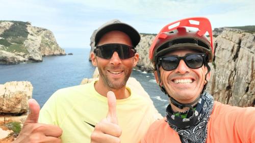 Guide and hiker on ebike during photo break 