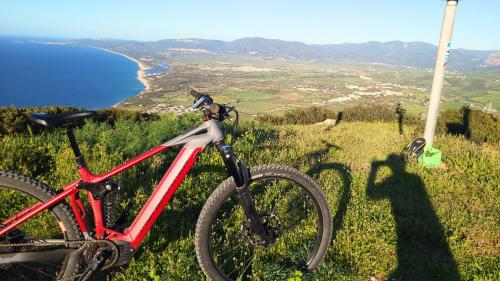 Ebike and panorama of the Gulf of Asinara