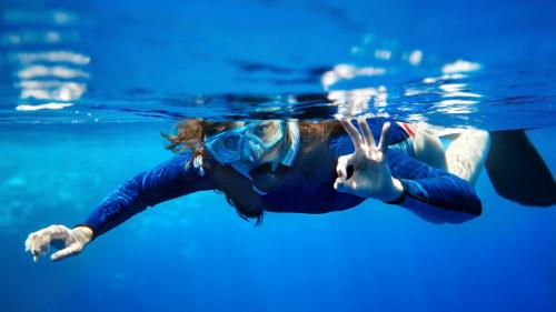 Girl snorkels in the Tavolara Marine Protected Area