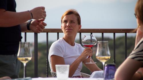 Girl tastes a rosé wine from the cellar in Palau