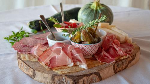 Chopping board of typical and organic products prepared by the chef for wine tasting in Palau