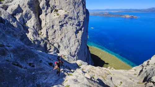 Person while climbing the rocks of Tavolara