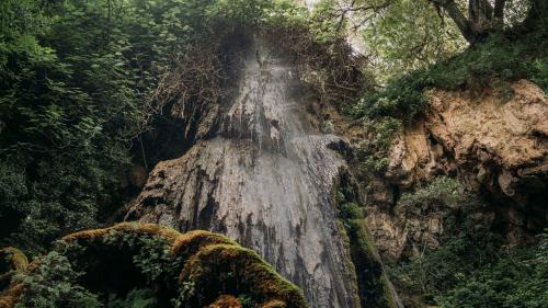 Natural waterfall within the Aymerich Park in southern Sardinia