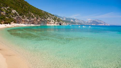 Crystal-clear waters of Cala Luna beach in the Gulf of Orosei