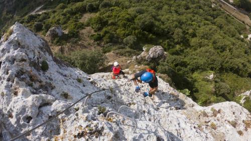 People climb the via Ferrata di Giorré in Cargeghe