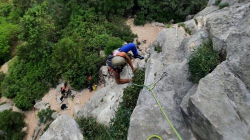 A man begins the ascent on the Needle Goloritzè