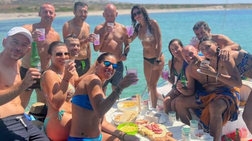 Aperitif aboard the catamaran in Asinara