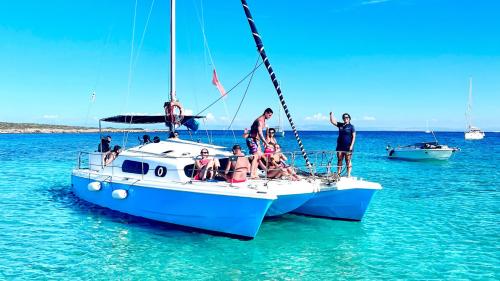 Catamaran stop in the crystal clear sea of the Gulf of Asinara