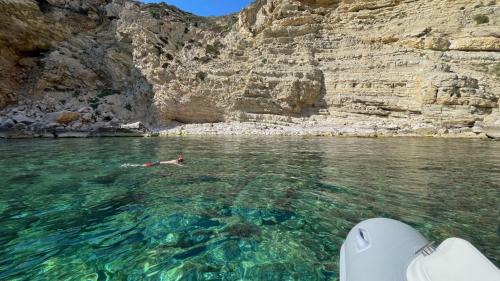 Boy snorkels in the Capo Caccia Marine Protected Area.